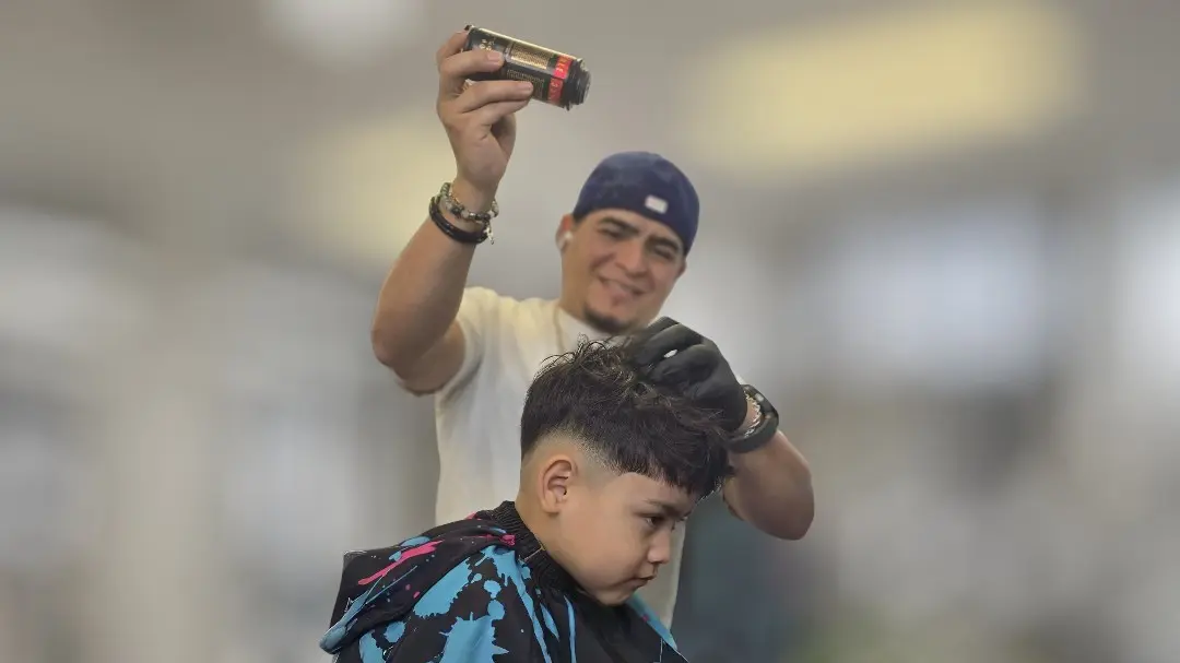 Barber giving haircut