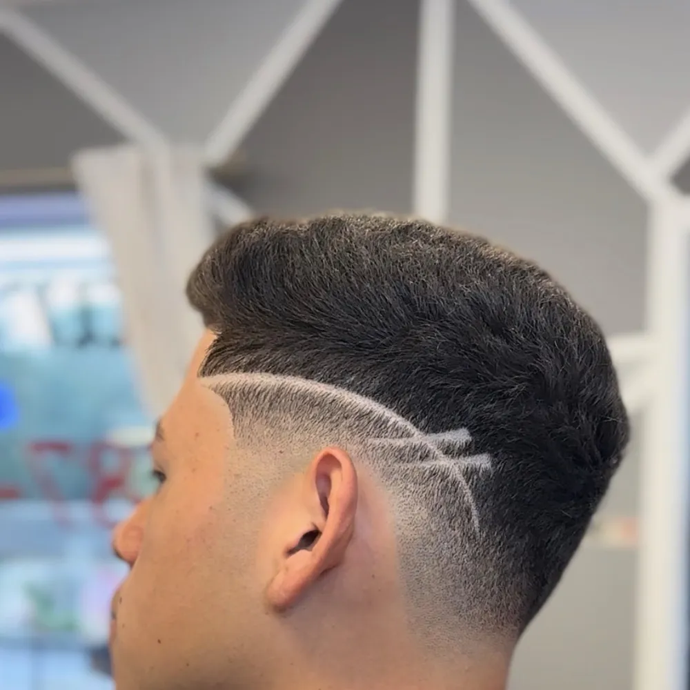 Taper fade with a freestyle line design